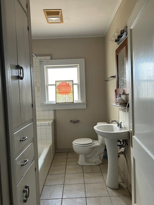 bathroom with ornamental molding, tile patterned floors,  shower combination, and toilet