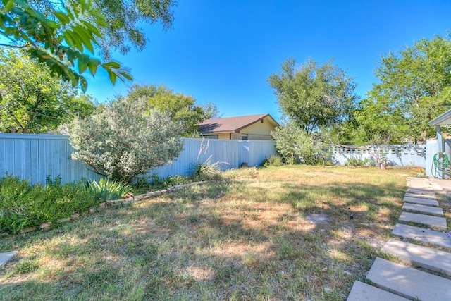 view of yard with a fenced backyard