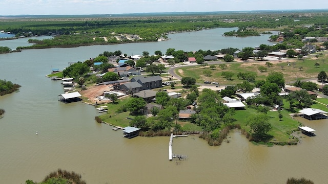  - bird's eye view of a nearby body of water and a heavily wooded area