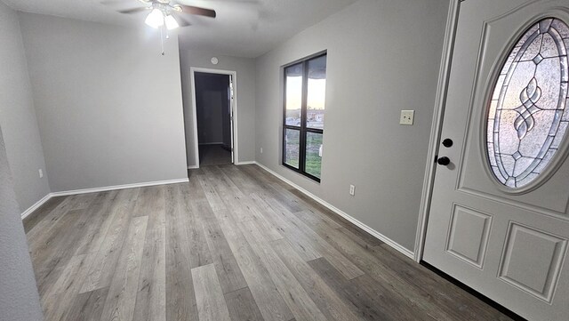 entryway with light hardwood / wood-style flooring and ceiling fan