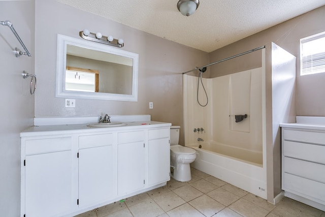 bathroom featuring vanity, toilet, tile patterned flooring, and a textured ceiling