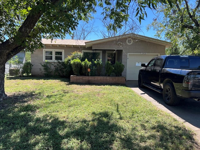 single story home with a garage and a front lawn