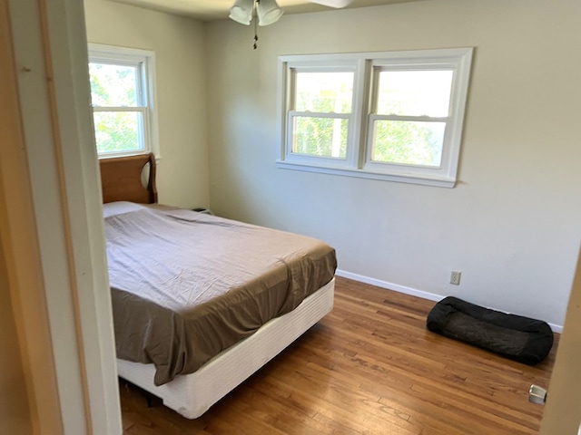 bedroom featuring wood-type flooring and ceiling fan