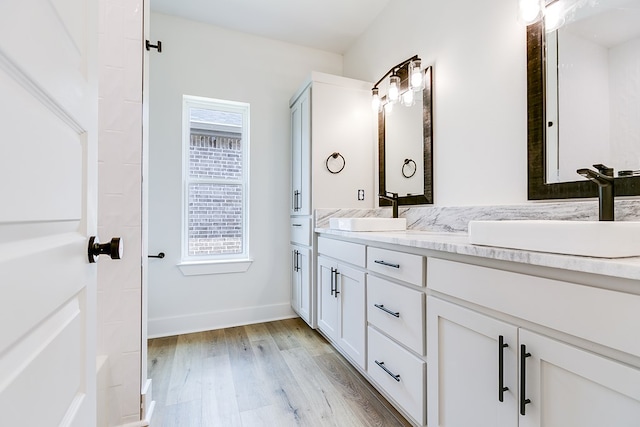 bathroom featuring hardwood / wood-style flooring and vanity