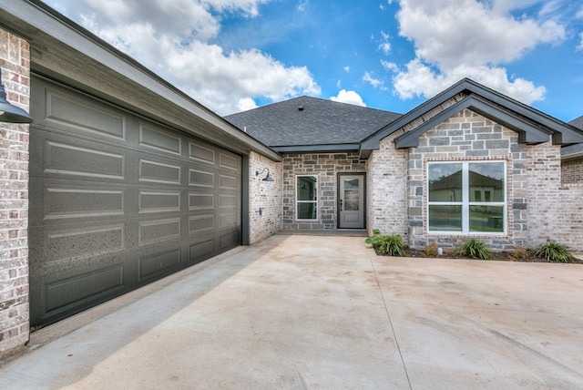 single story home featuring a garage