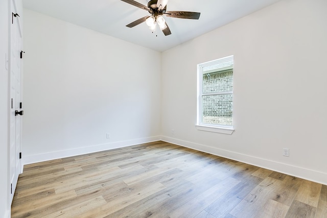 unfurnished room with ceiling fan and light wood-type flooring