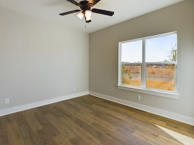 unfurnished room featuring hardwood / wood-style floors and ceiling fan