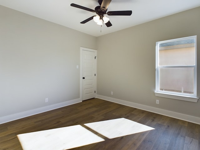 empty room featuring dark hardwood / wood-style floors and ceiling fan