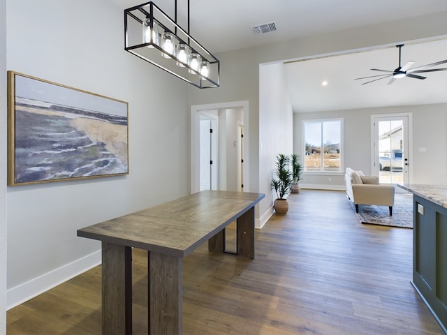 kitchen featuring dark hardwood / wood-style floors, pendant lighting, and ceiling fan