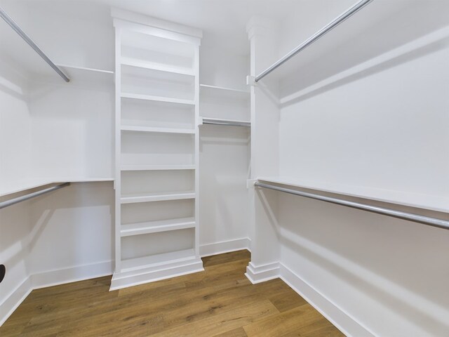 spacious closet featuring hardwood / wood-style floors