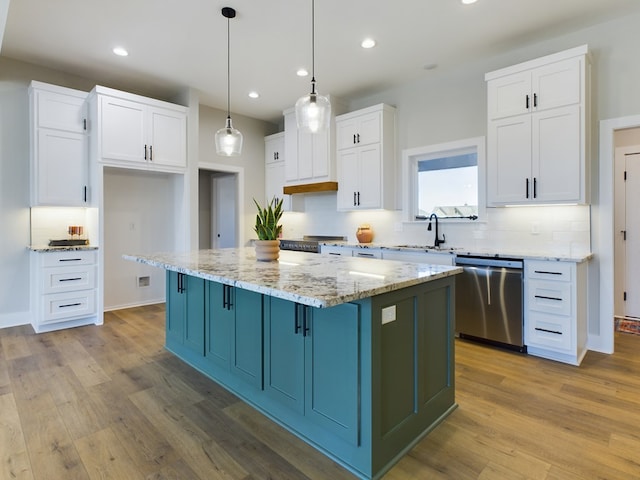 kitchen featuring white cabinetry, dishwasher, and a center island