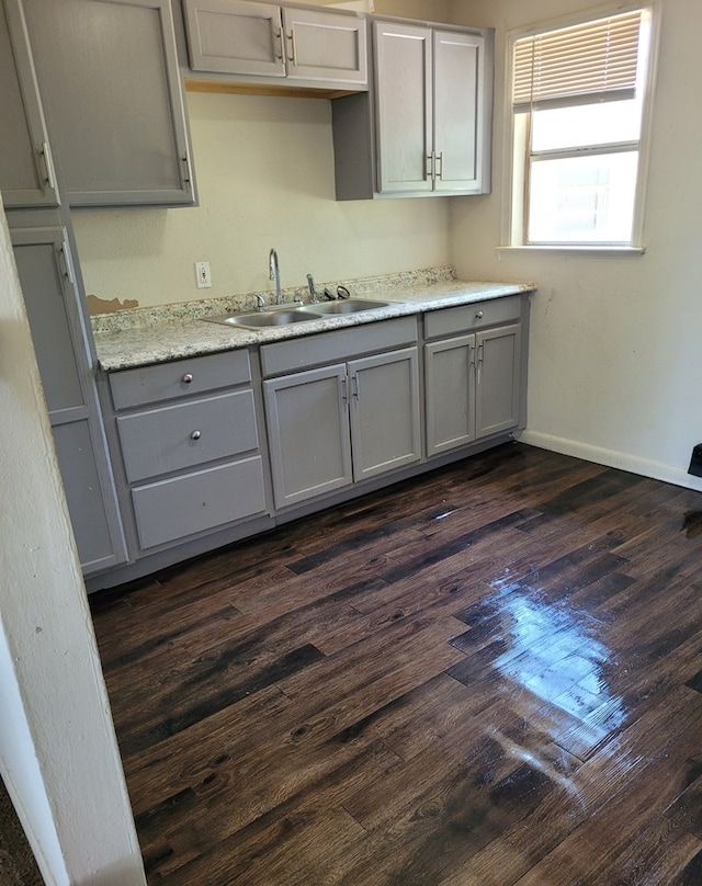 405 E 41st St, San Angelo, TX 76903 - kitchen featuring gray cabinetry, dark wood-style floors, and light countertops