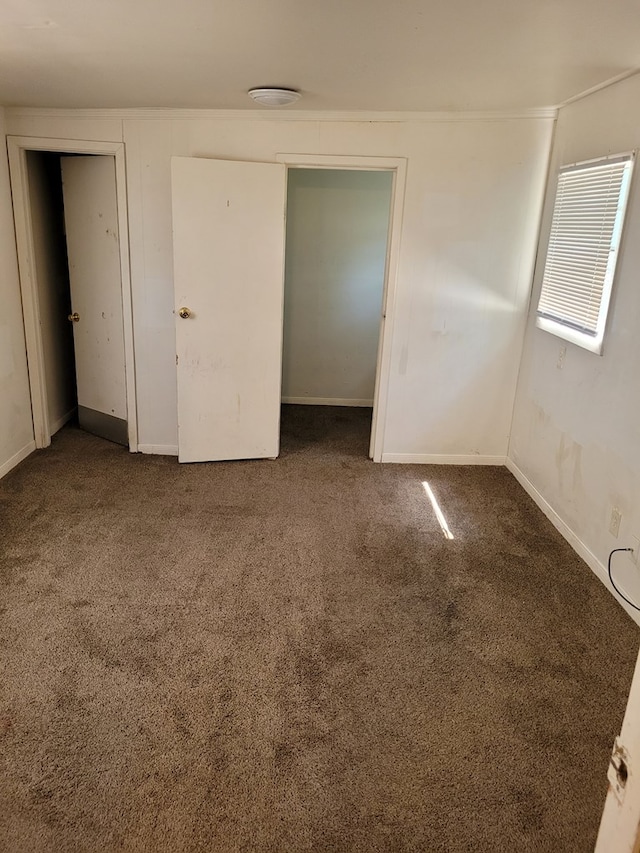 405 E 41st St, San Angelo, TX 76903 - unfurnished bedroom featuring carpet flooring