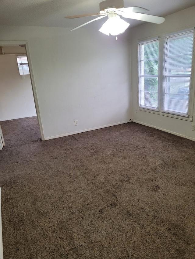 405 E 41st St, San Angelo, TX 76903 - unfurnished room with dark carpet and ceiling fan