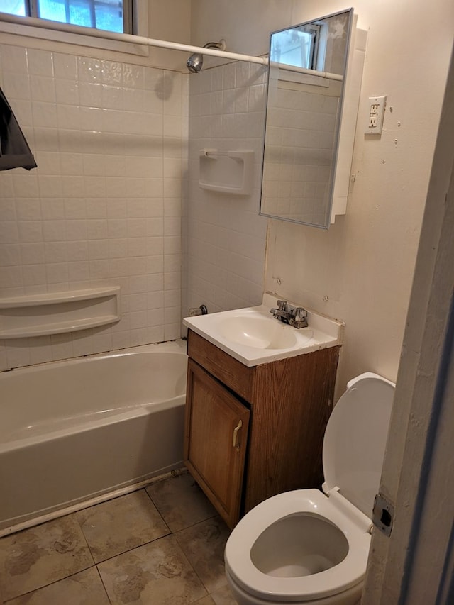 405 E 41st St, San Angelo, TX 76903 - bathroom featuring plenty of natural light, vanity, tub / shower combination, and tile patterned floors