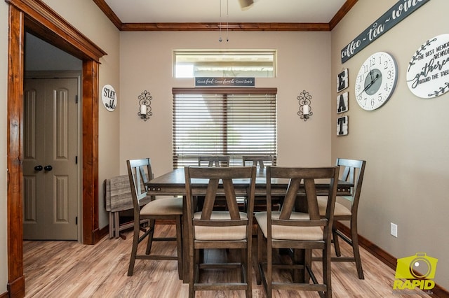 3286 Ponca Path, San Angelo, TX 76901 - dining area featuring light wood-style flooring, crown molding, baseboards, and a ceiling fan