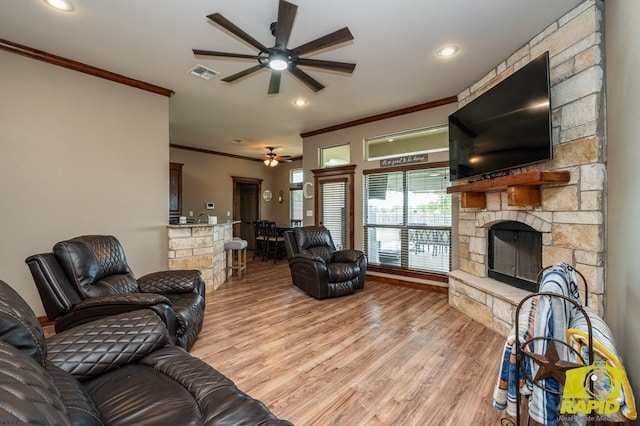 3286 Ponca Path, San Angelo, TX 76901 - living area featuring crown molding, ceiling fan, a fireplace, light wood-type flooring, and recessed lighting