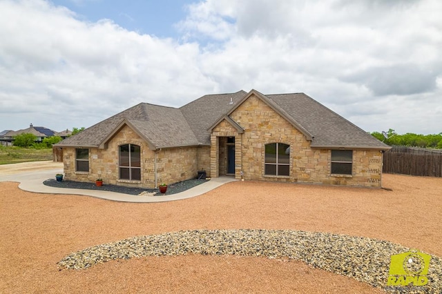 3286 Ponca Path, San Angelo, TX 76901 - view of front of house with stone siding and roof with shingles