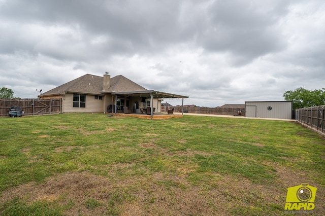 3286 Ponca Path, San Angelo, TX 76901 - rear view of property featuring a patio, a chimney, and an outdoor structure