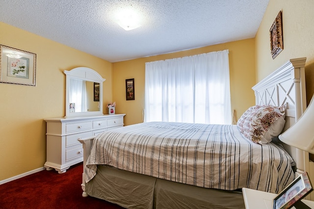 carpeted bedroom with a textured ceiling