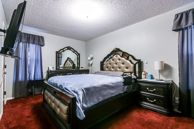 carpeted bedroom featuring a textured ceiling