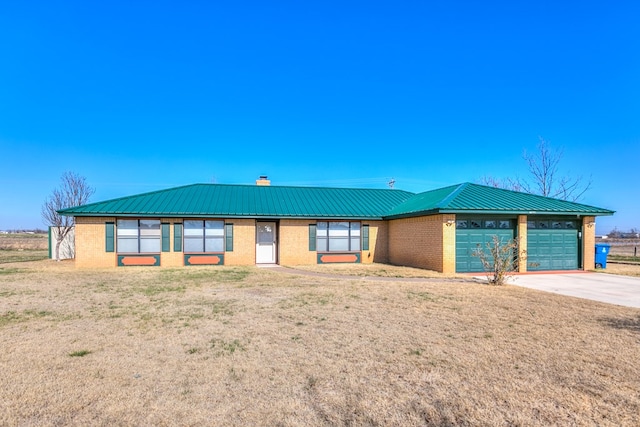 single story home featuring a garage and a front lawn