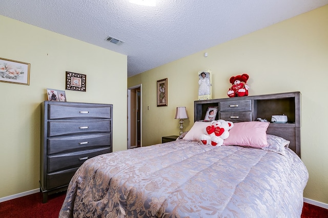 bedroom with a textured ceiling