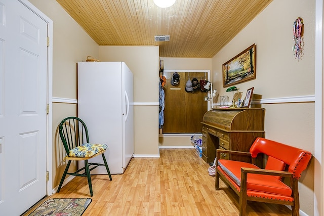 sitting room featuring wood ceiling and light hardwood / wood-style flooring