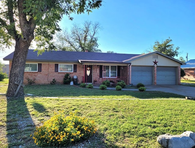 ranch-style home with a garage, covered porch, and a front yard