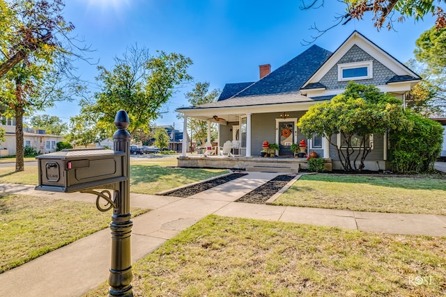 1325 S David St, San Angelo, TX 76901 - view of front of property with a porch, a front yard, a chimney, and roof with shingles