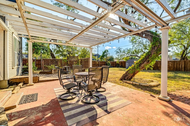 1325 S David St, San Angelo, TX 76901 - fenced backyard featuring a shed, a patio, outdoor dining area, and a pergola