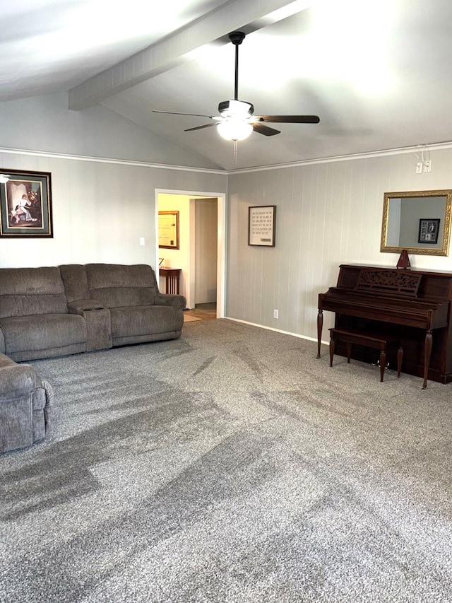 carpeted living room with vaulted ceiling with beams and ceiling fan