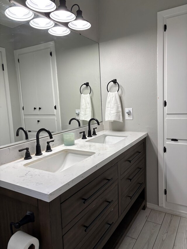 bathroom featuring hardwood / wood-style flooring and vanity