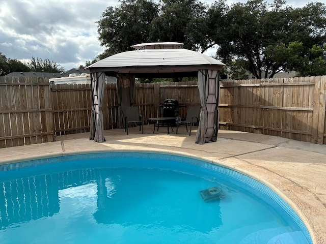 view of swimming pool with a gazebo