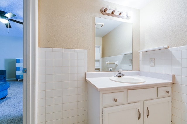 bathroom featuring ceiling fan and vanity