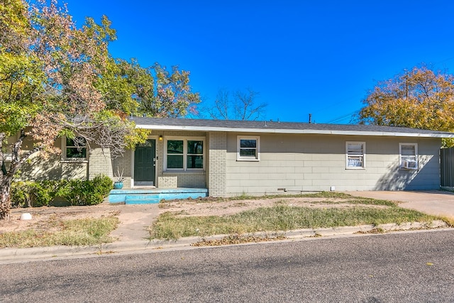 single story home featuring cooling unit