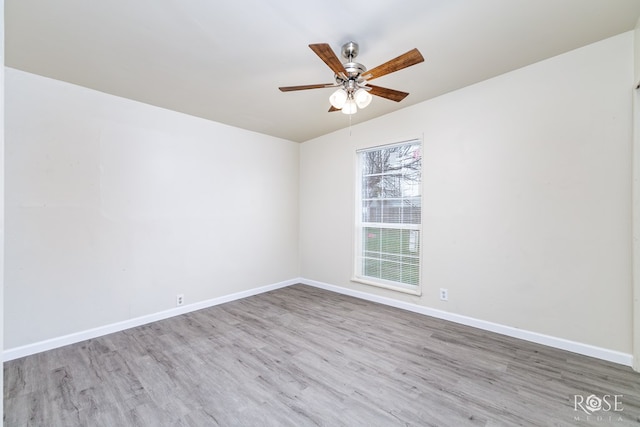 unfurnished room with ceiling fan and light hardwood / wood-style flooring