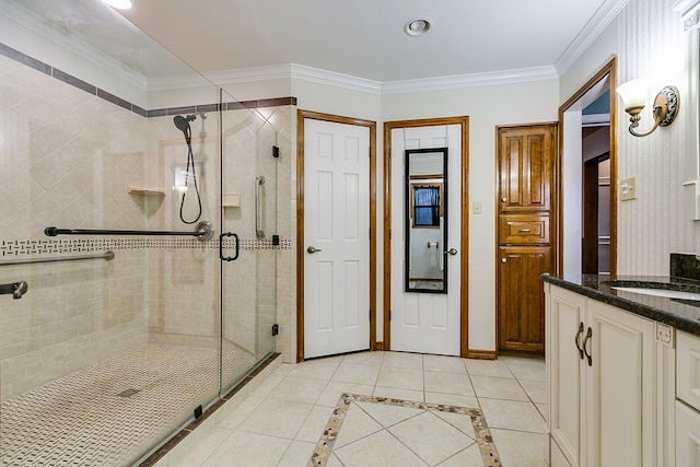 full bathroom featuring tile patterned floors, a stall shower, vanity, and ornamental molding