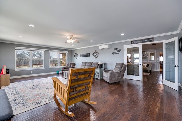 living room with french doors, dark wood-style floors, and a wall mounted AC