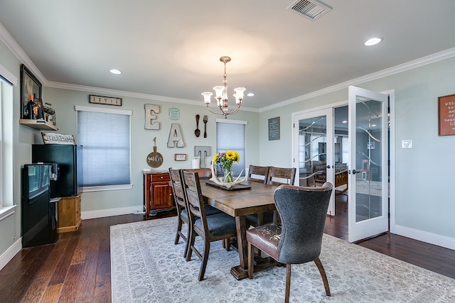 dining room with dark wood finished floors, visible vents, french doors, and baseboards