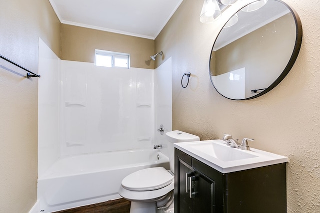 bathroom with a textured wall, vanity, ornamental molding, and shower / bathtub combination