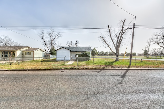 bungalow featuring a front lawn and fence private yard