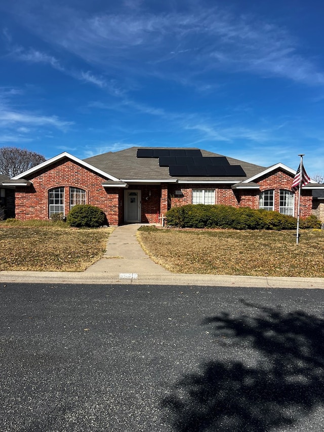 3514 Shadyhill Dr, San Angelo, TX 76904 - view of front of home with brick siding and roof mounted solar panels