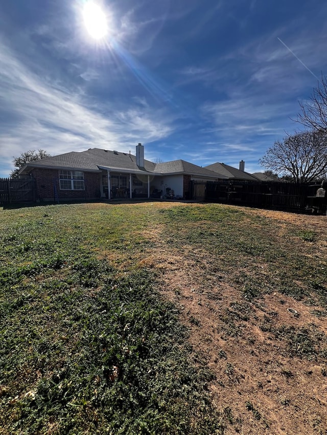 3514 Shadyhill Dr, San Angelo, TX 76904 - back of house featuring a chimney and brick siding