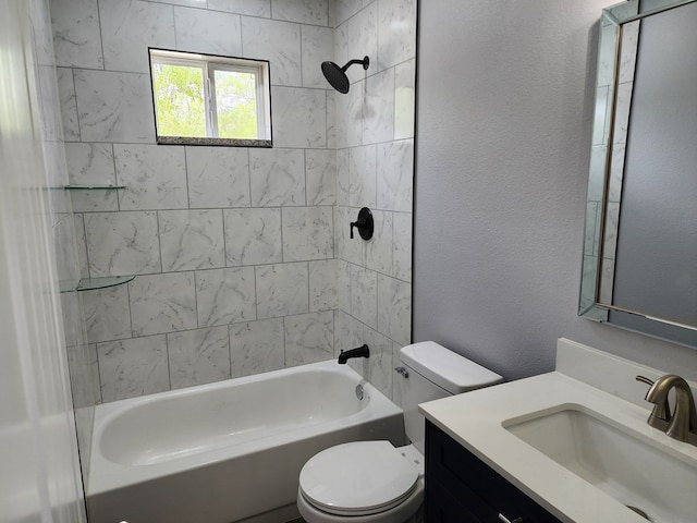 full bathroom with tiled shower / bath, vanity, and toilet