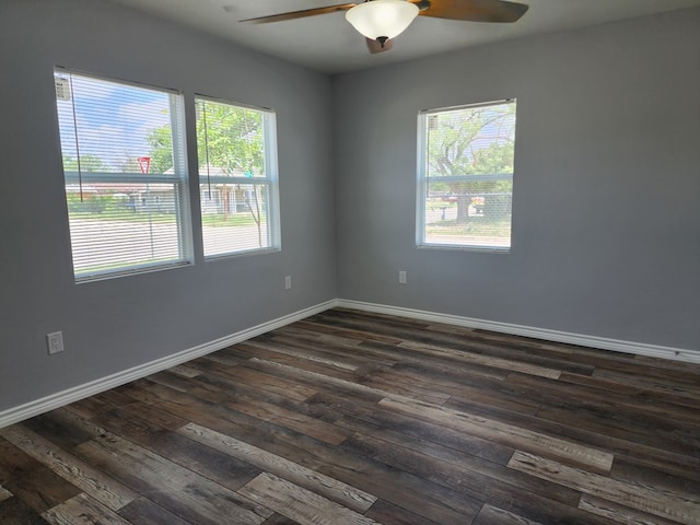 spare room with dark hardwood / wood-style flooring, plenty of natural light, and ceiling fan