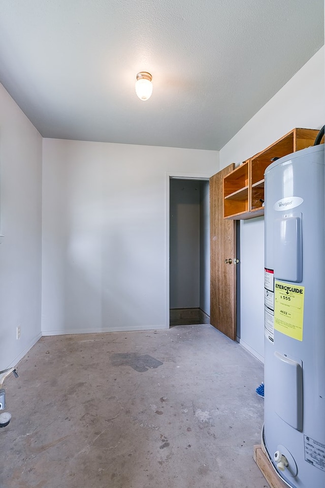 4302 Homestead Cir, Wall, TX 76903 - garage with electric water heater and baseboards