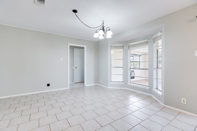 4302 Homestead Cir, Wall, TX 76903 - empty room with a chandelier, baseboards, and light tile patterned floors