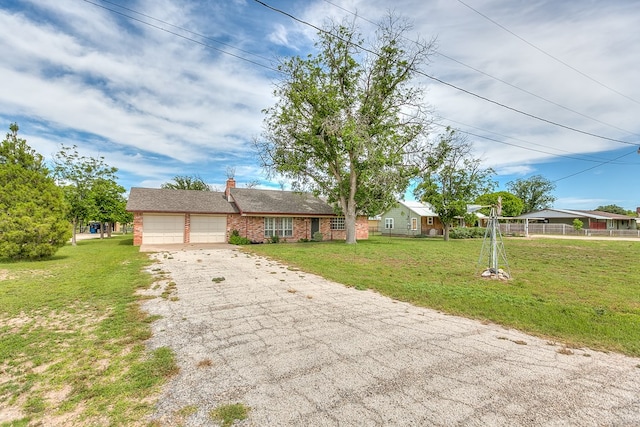 4302 Homestead Cir, Wall, TX 76903 - single story home featuring a garage, asphalt driveway, and a chimney