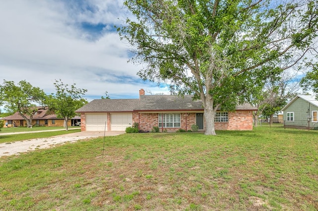 4302 Homestead Cir, Wall, TX 76903 - single story home featuring concrete driveway, an attached garage, a front yard, brick siding, and a chimney